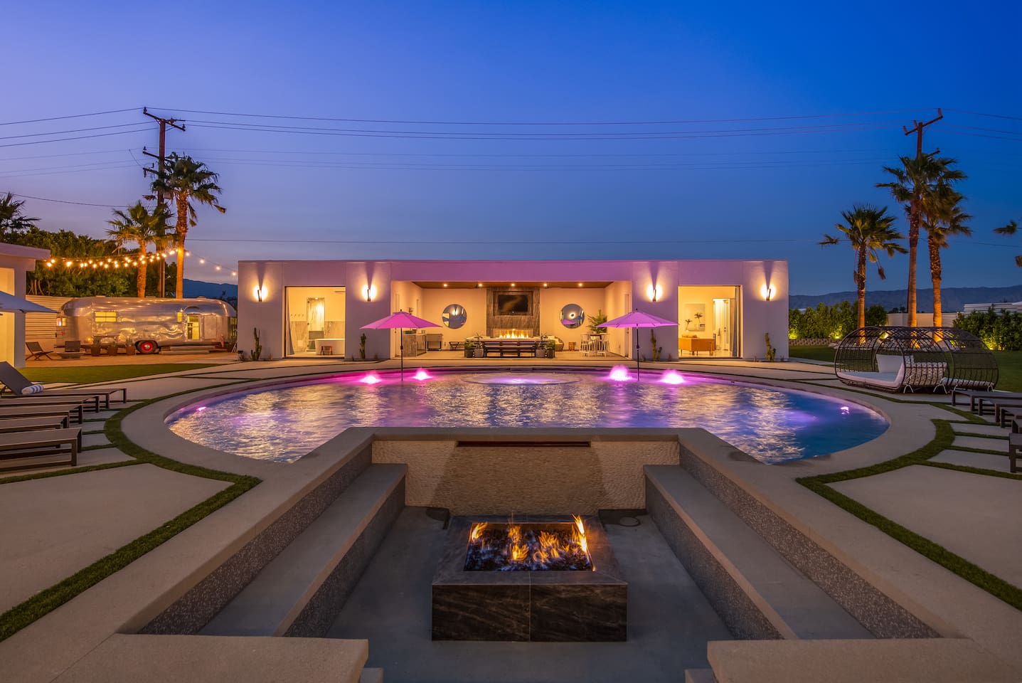 Pool and fire pit at night